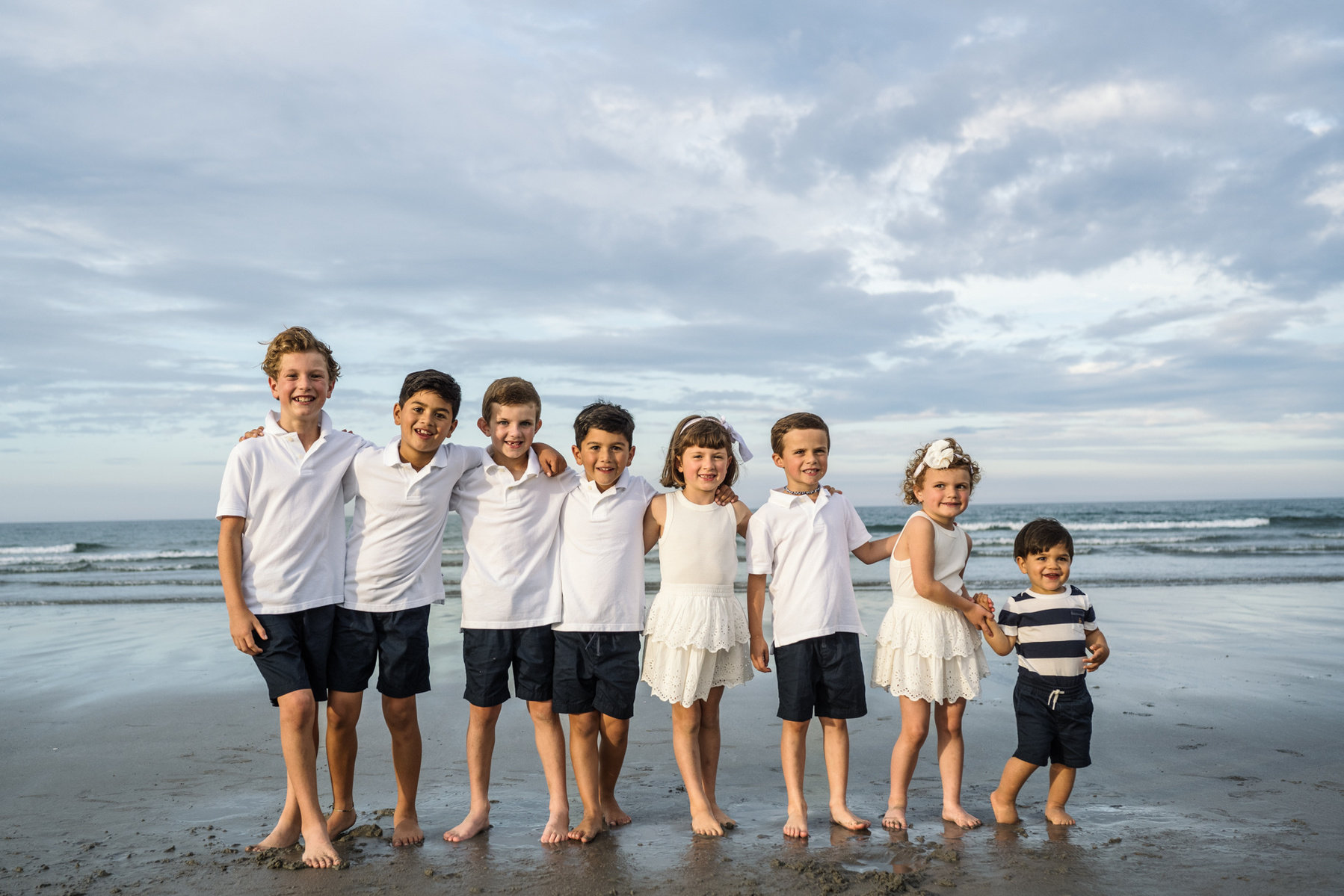 Grandkids on the beach in summer during their Nantasket Beach family photography session