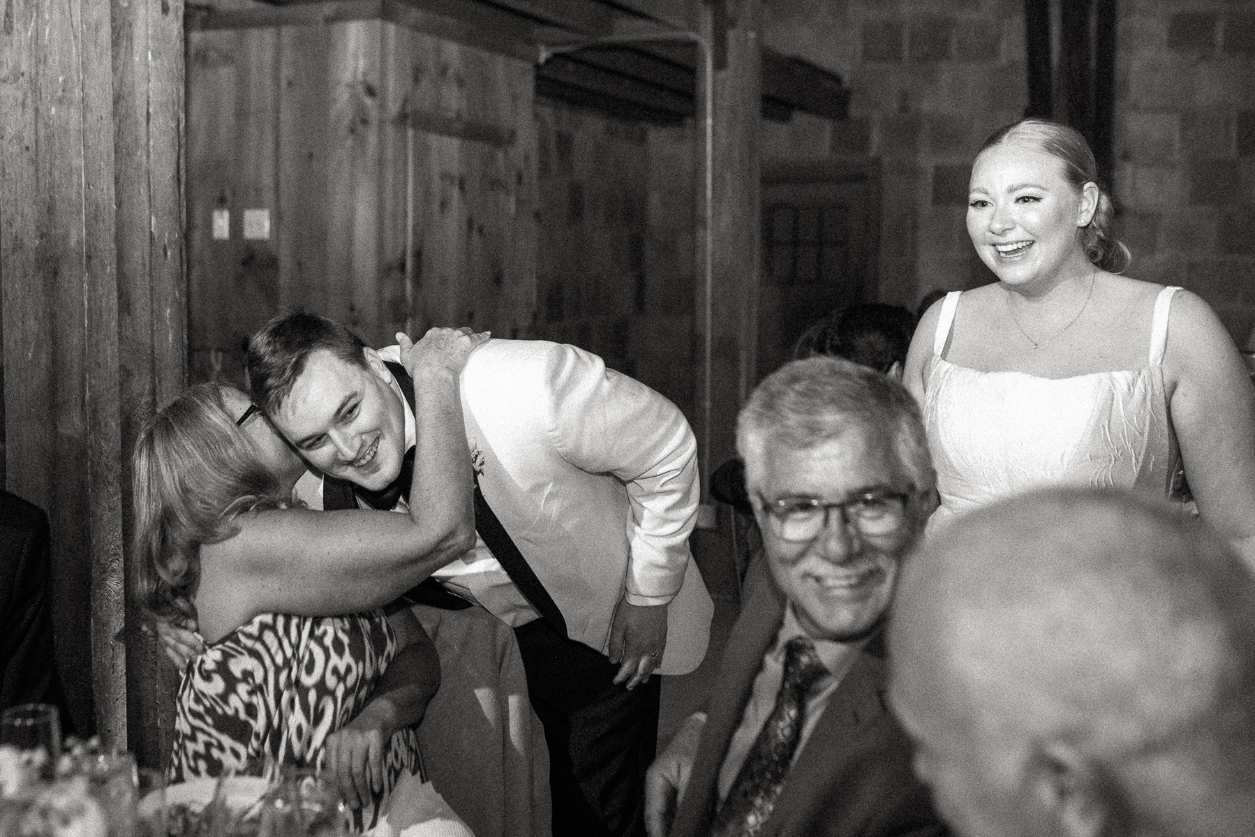 A couple hugs their guests at their Crane Estate wedding