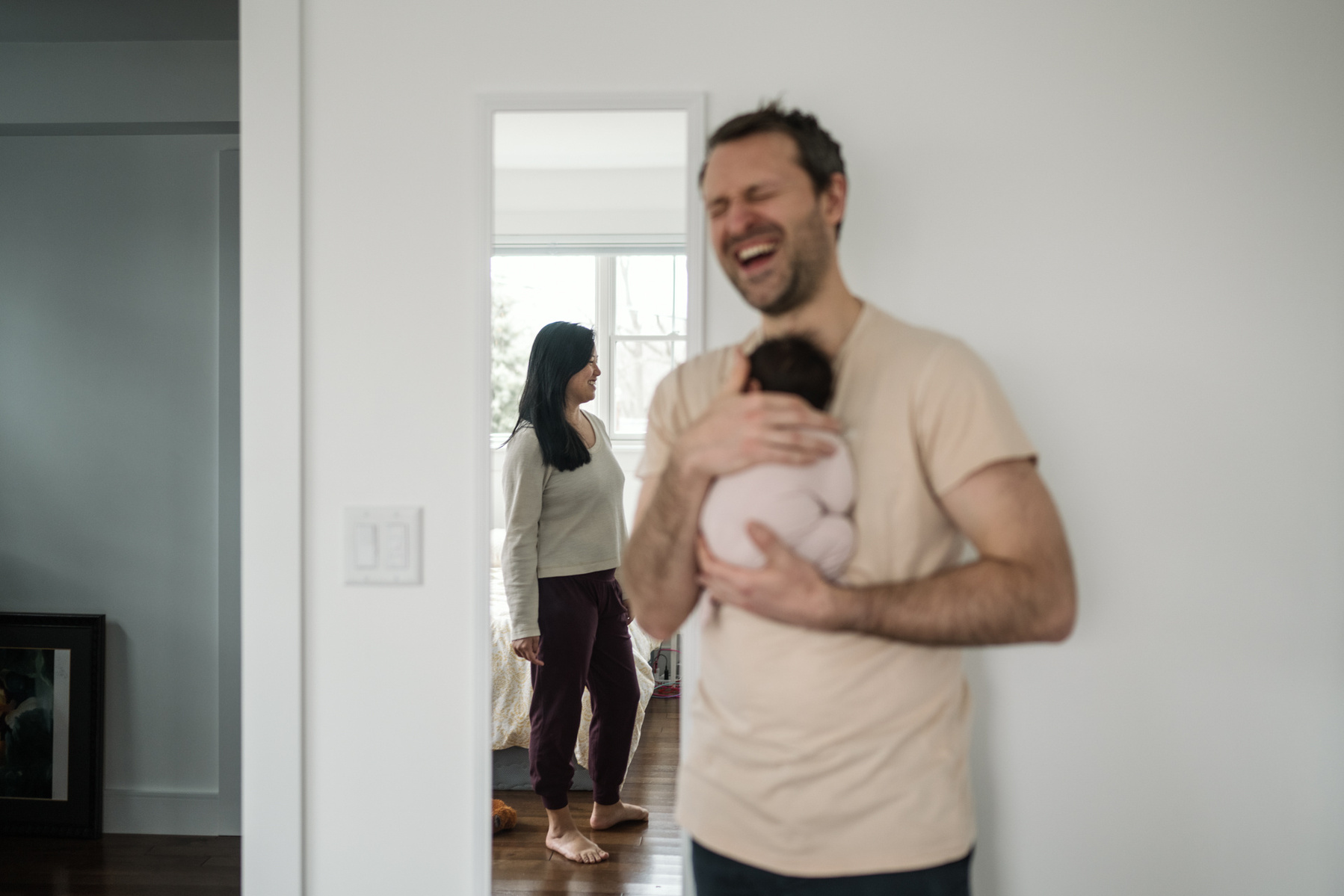 Dad laughs during an arlington ma newborn photography session
