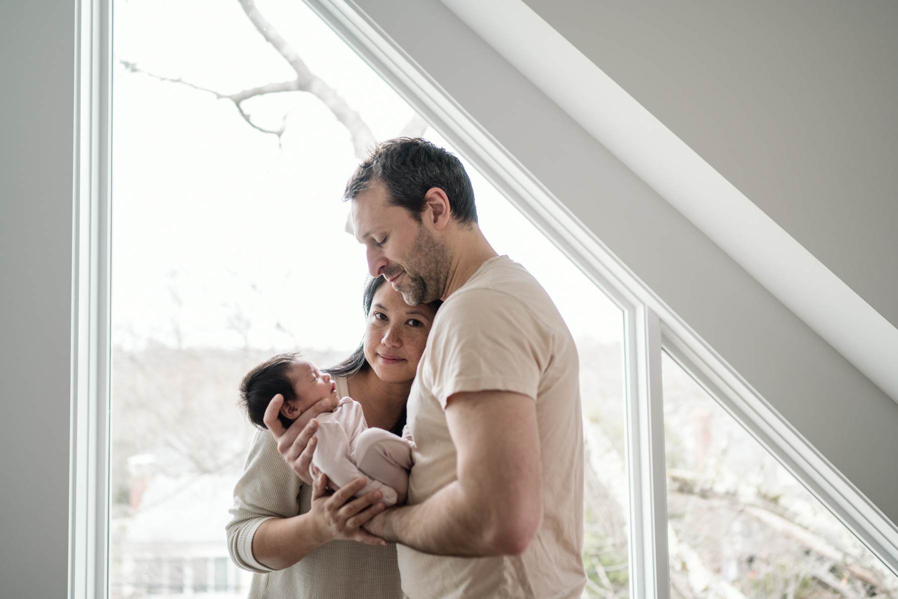 Mom smiles during an arlington ma newborn photography session