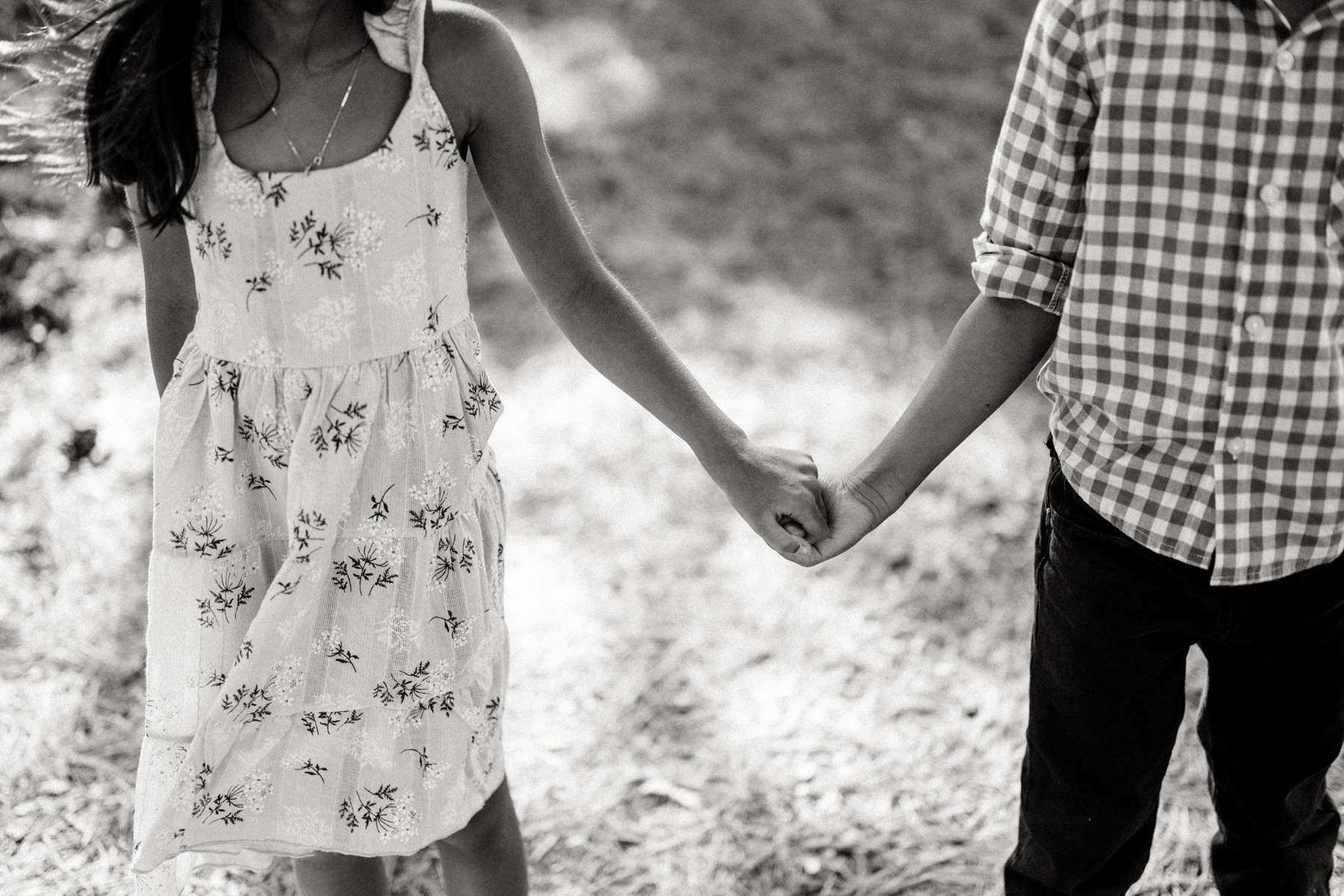 two young children hold hands during their jamaica plain family photography session