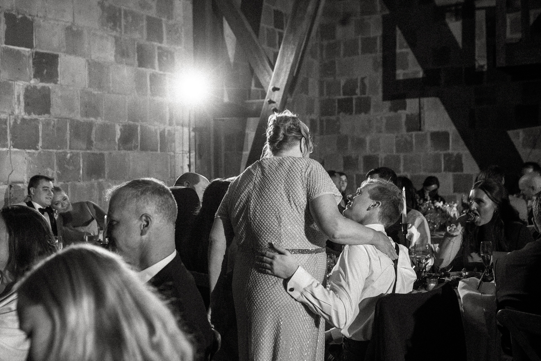 A mother hugs her son at a Crane Estate wedding reception