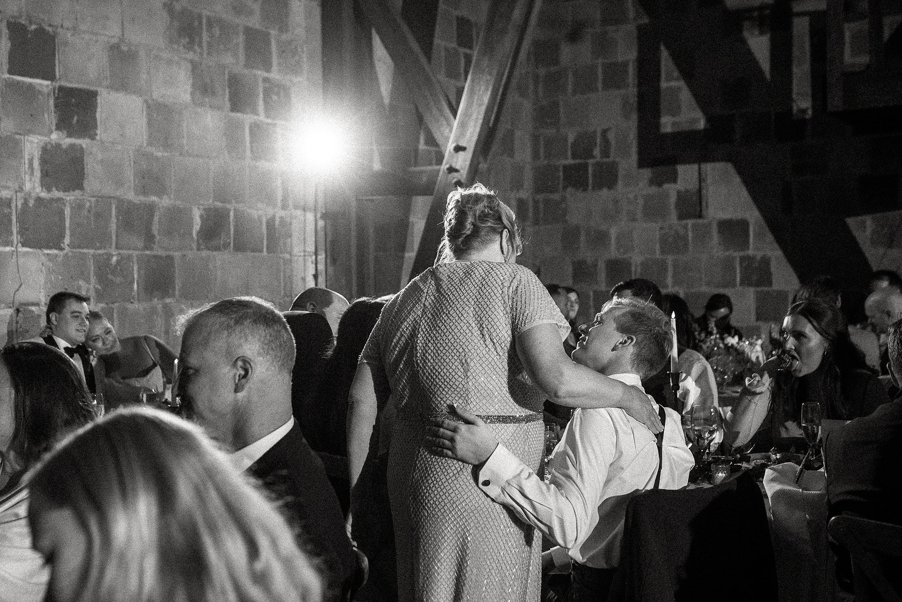 A mother hugs her son at a Crane Estate wedding reception