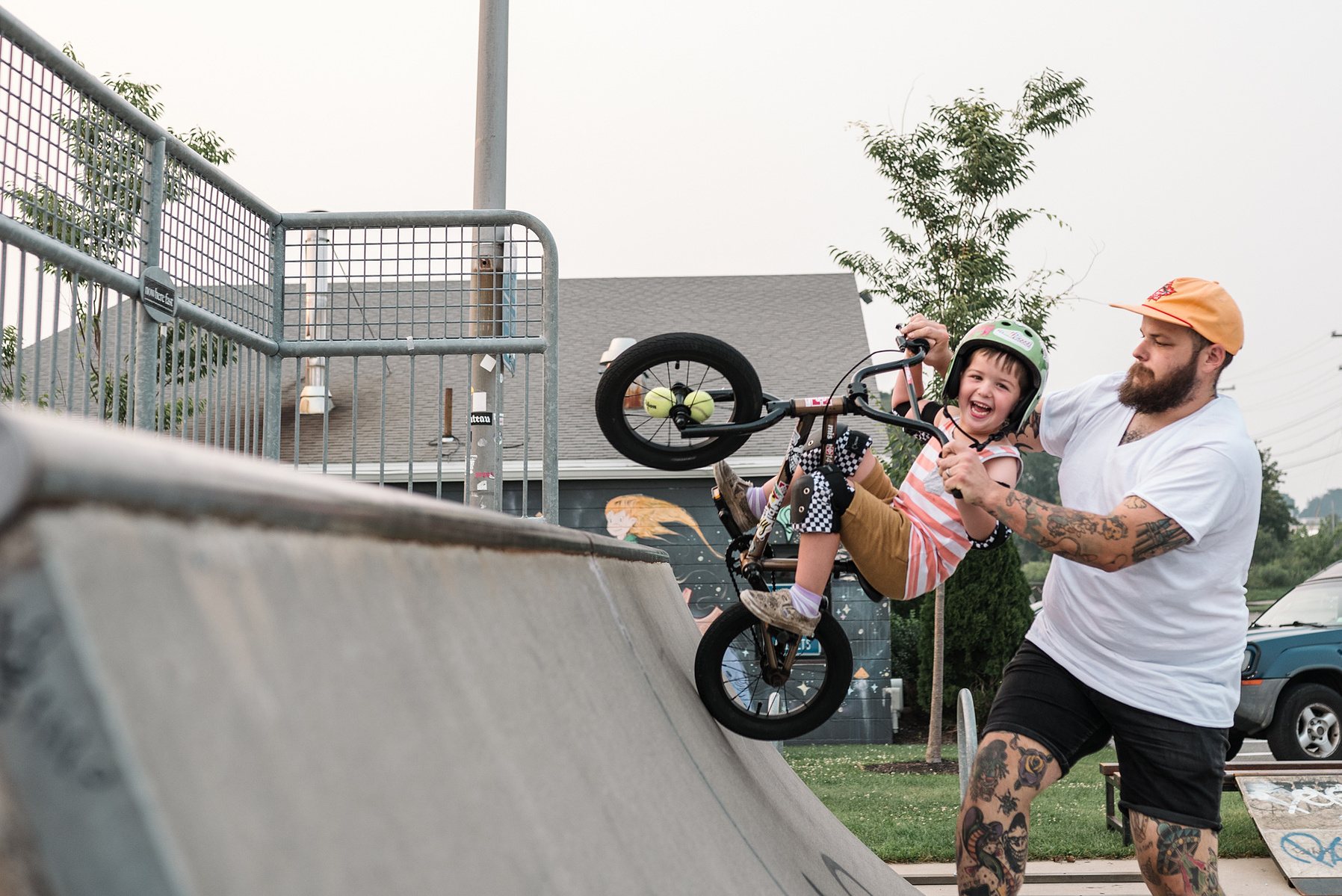 A young boy rides a bmx bike during a family photo shoot at Innocenti skatepark in Beverly MA