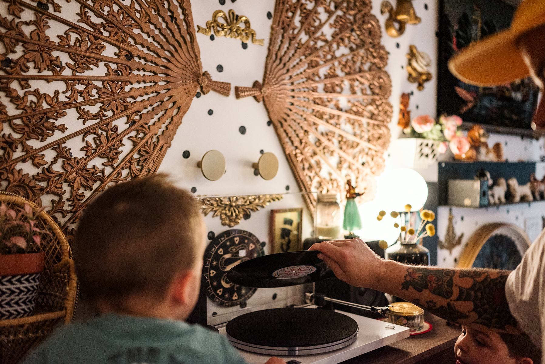 A family listens to records in their maximalist designed Salem MA home captured by boston family photographer Korri Leigh photography