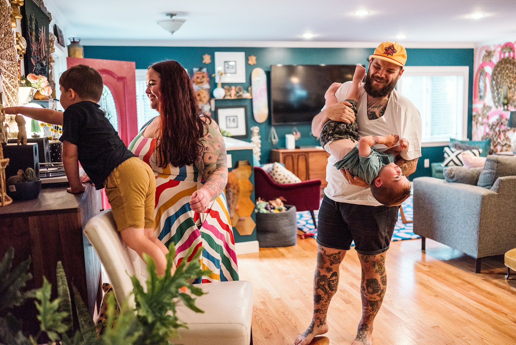 A family listens to records in their maximalist designed Salem MA home captured by boston family photographer Korri Leigh photography