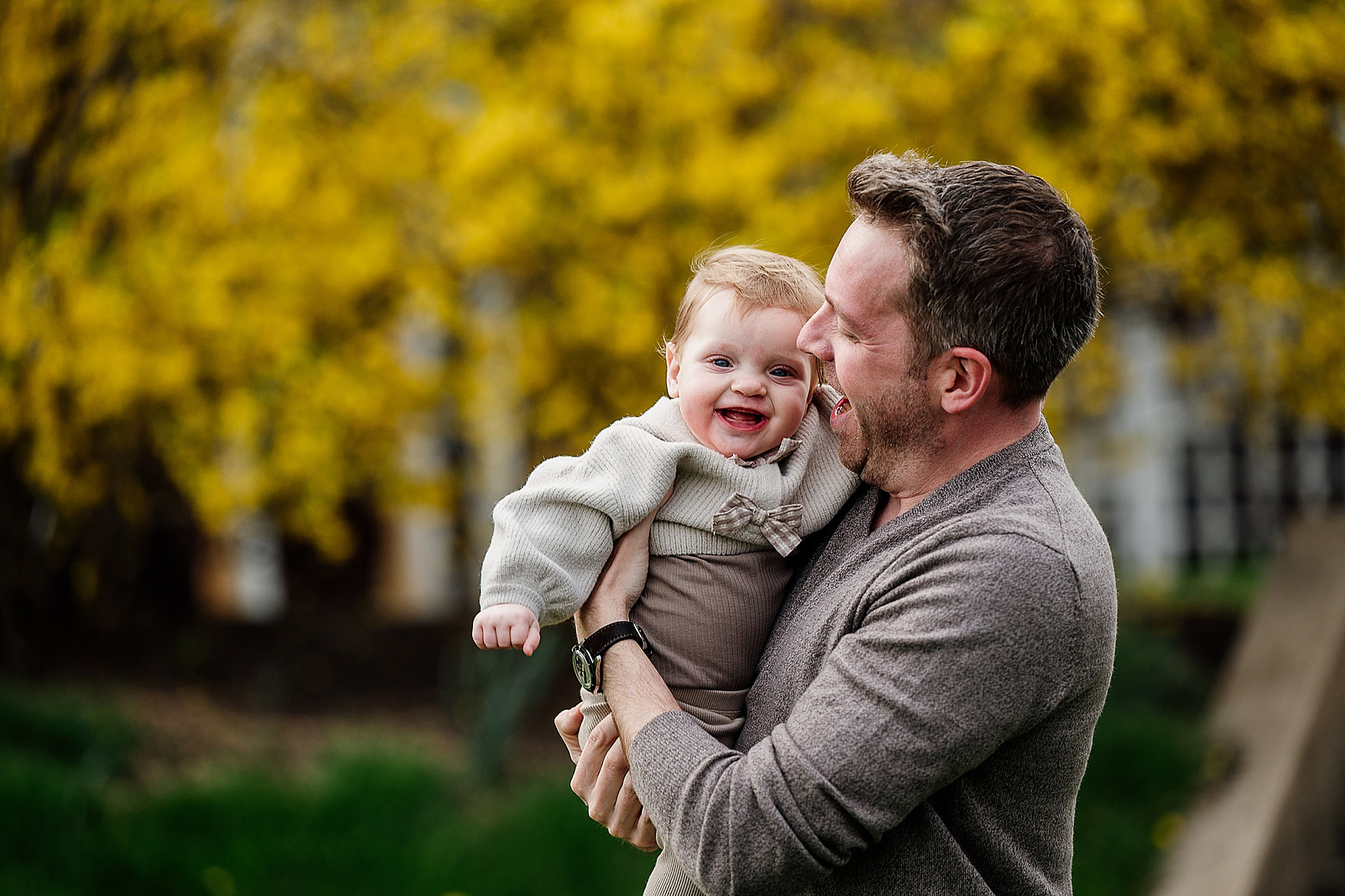 A Dad snuggles his baby daughter during their boston family photography session captured by west roxbury family photographer korri leigh crowley 