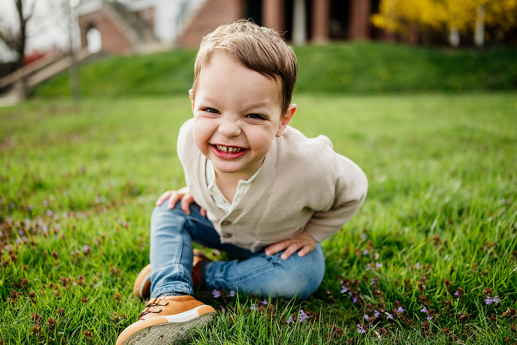 A young boy smiles during his boston family photography session captured by west roxbury family photographer korri leigh crowley