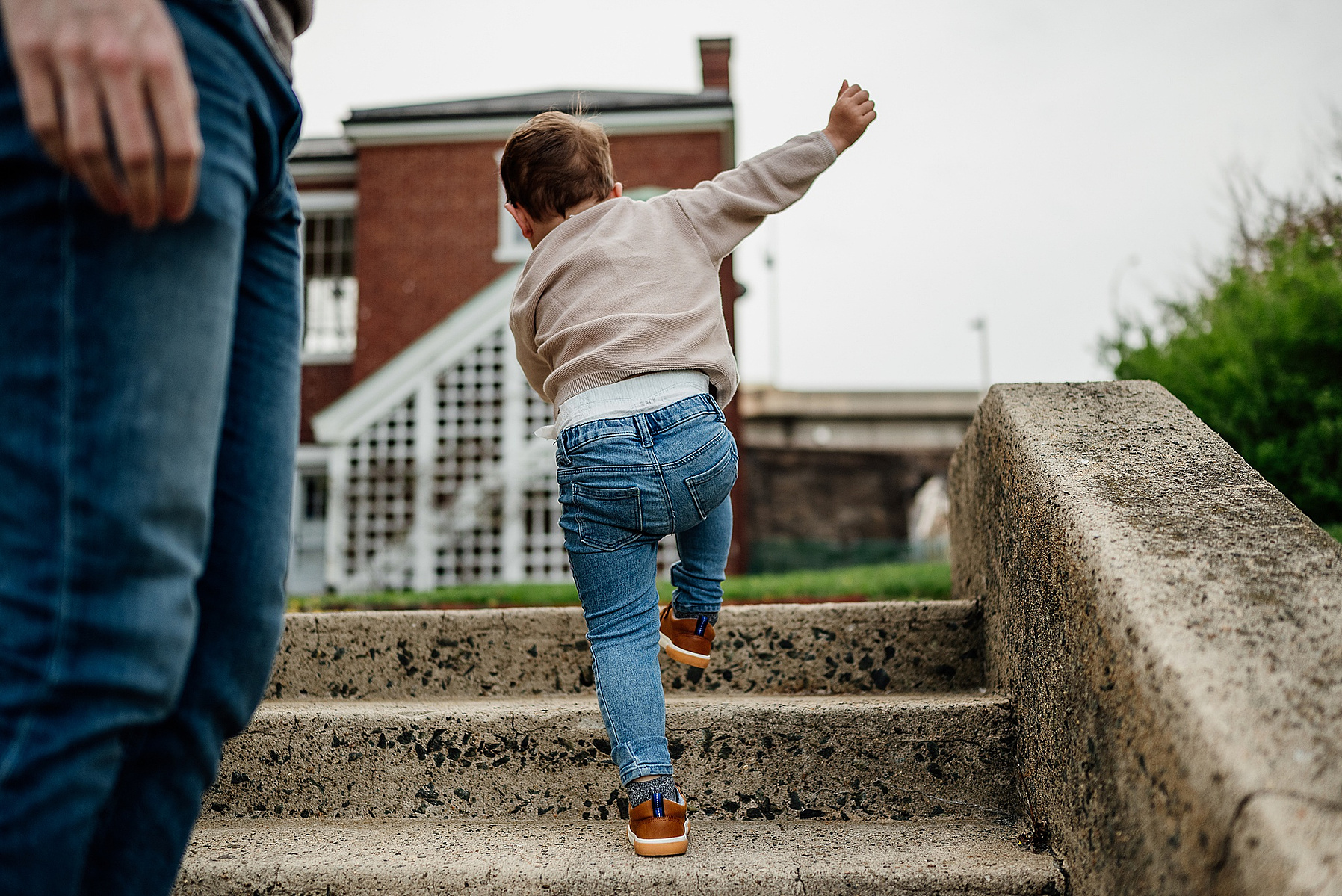 A young boy plays during his boston family photography session captured by west roxbury family photographer korri leigh crowley
