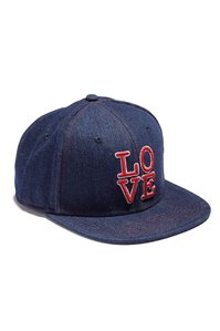 blue denim baseball cap hat with graphic of the word love stitched on the front