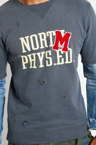 closeup of model torso wearing grey t shirt and denim long sleeves