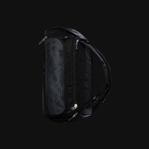 Dark grey and blue backpack with side pockets and straps and metal zippers floating in black dark space with soft light
