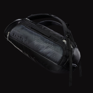 Dark grey and blue backpack with side pockets and straps and metal zippers floating in black dark space with soft light
