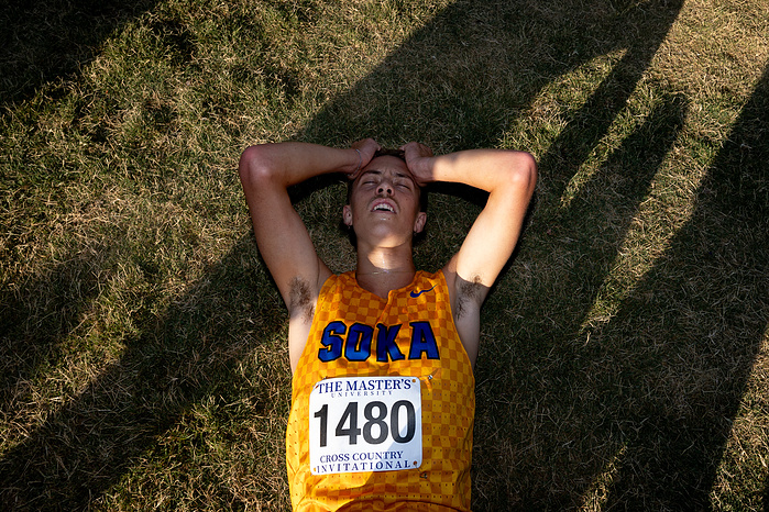 Laying down trying to catch his breath after running his fastest 8km of the season at Master’s Invitational.