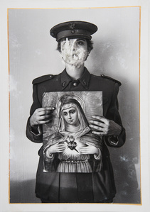 A girl without a face dressed as a soldier holding the potrait of the Virgin