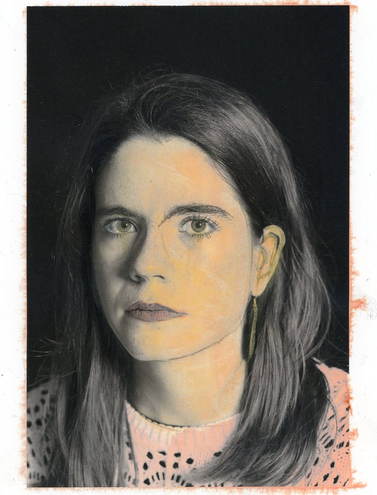 Portrait of a girl with brown hair that has been painted in yellow and orange