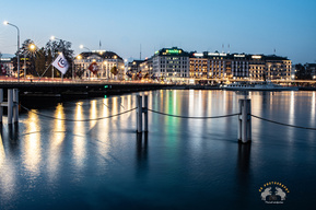 View of Mont Blanc bridge along with Luxury hotels and Rolex building in Geneva