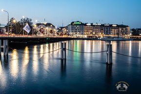View of Mont Blanc bridge along with Luxury hotels and Rolex building in Geneva