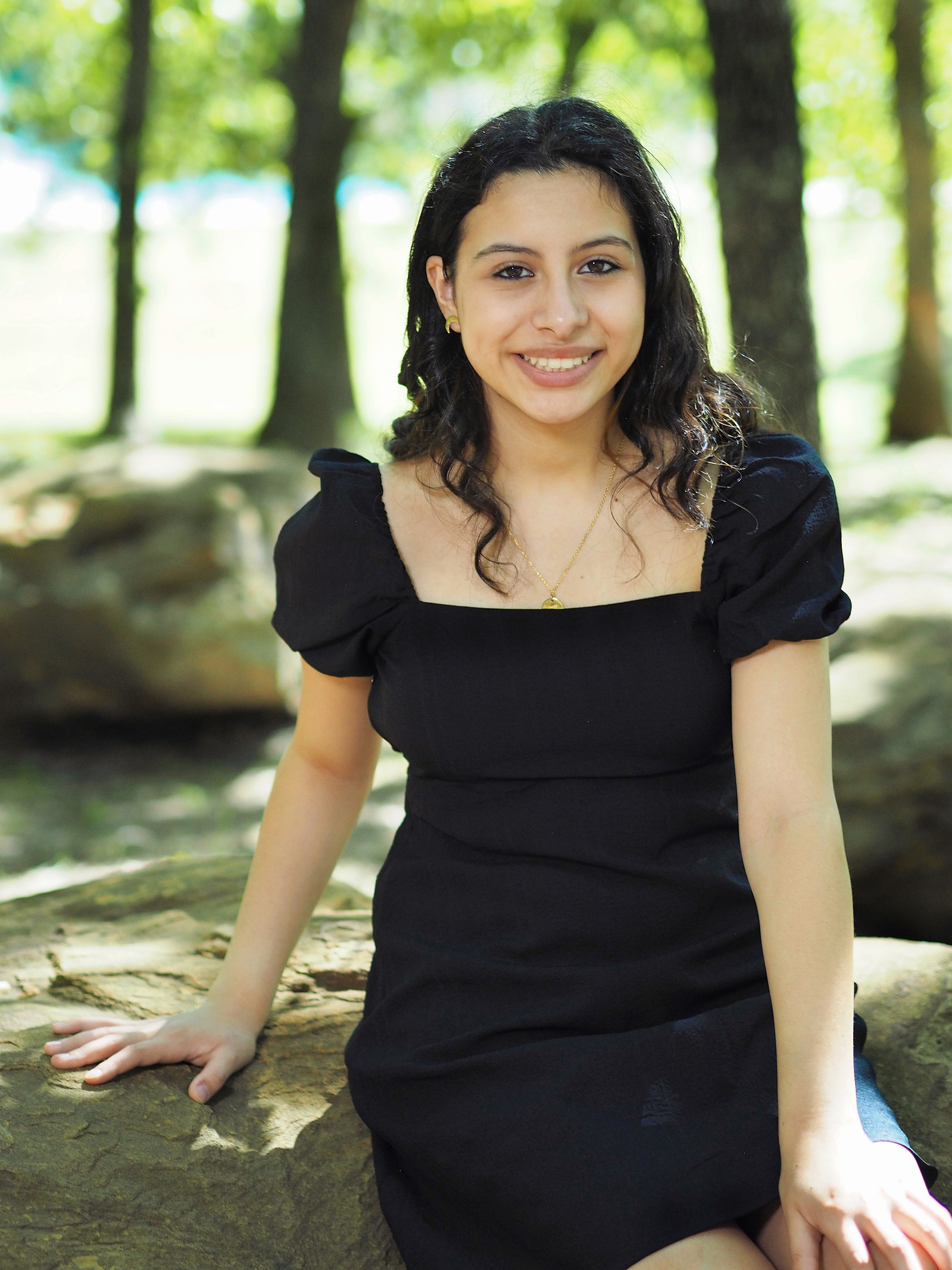 Teenage girl outdoors portrait under trees using an ND filter and the EM5 II