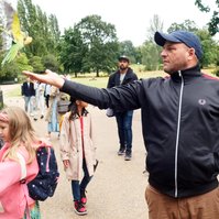 A dad feeding the birds in Hyde Park