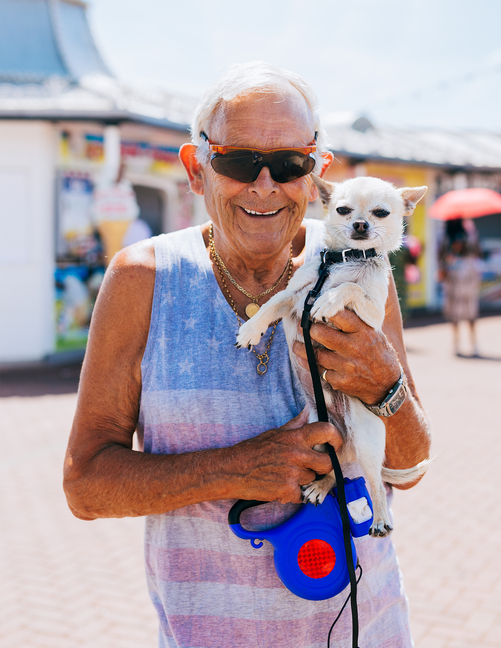 A man and his dog by the pier.