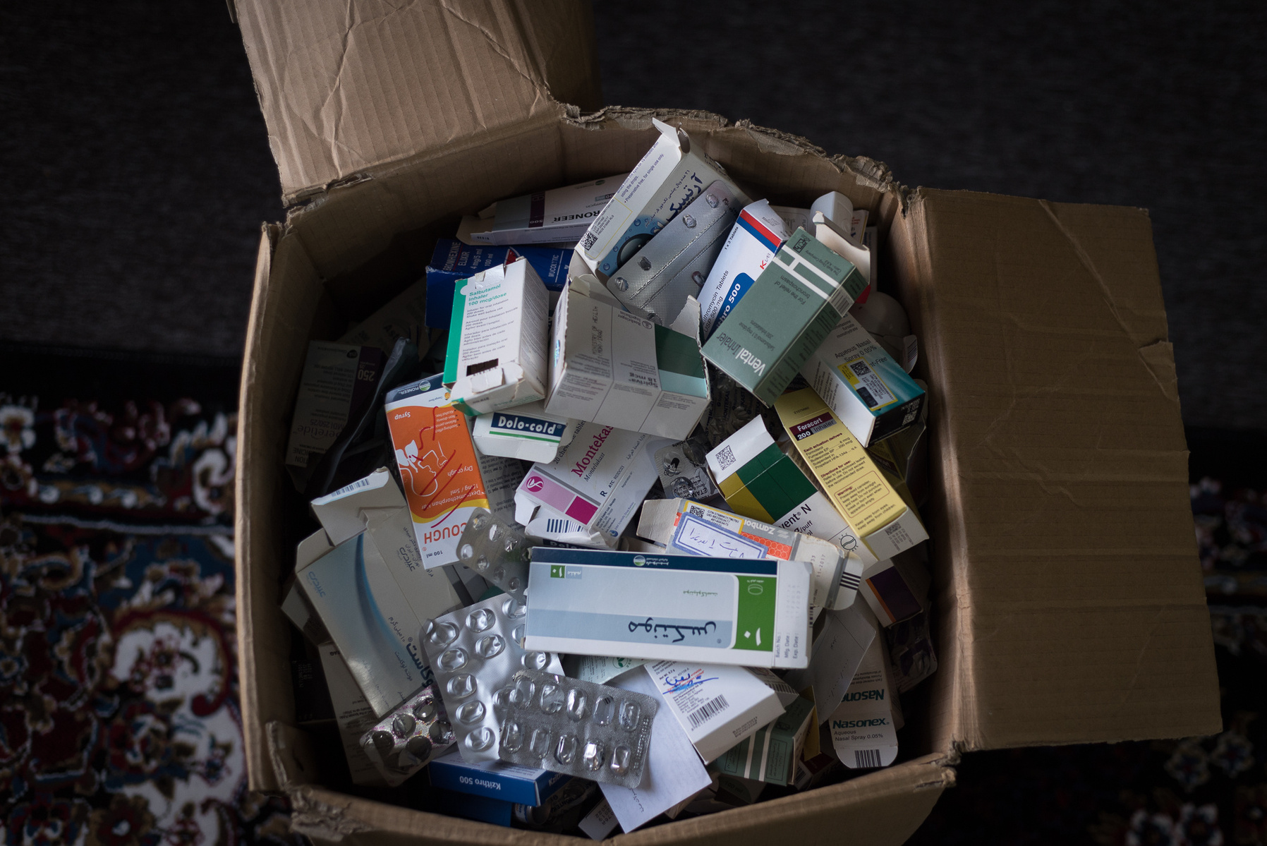 Halabja, KRI. A one meter-deep paper box is filled with the empty medicine boxes that Hawkar Sabre Mohammad (36) took over the past year. Sabre is a survivor of the chemical attack that hit Halabja on the 16th of March 1988. Three years ago, he decided to