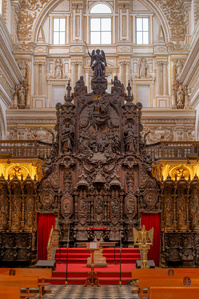 The Episcopal Throne inside the Mosque-Cathedral of Córdoba showcases intricate woodwork and historical religious significance.