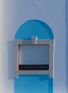 Window with blue and grey tones, reflecting a calm and subdued mood.