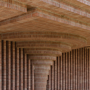 Architectural detail of the brickwork and arches of Torreciudad Sanctuary