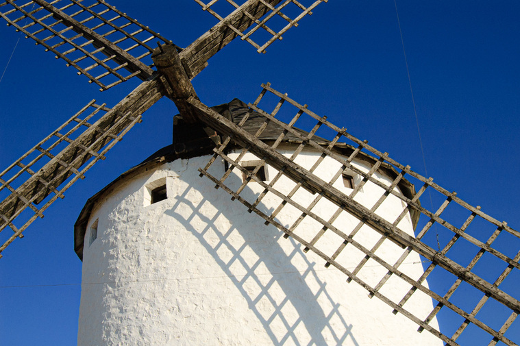 Almost decayed wooden Spanish windmill from earlier times in La Mancha, Spain.