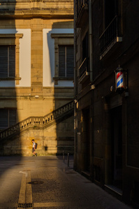 &amp;amp;quot;A candid moment of a young boy with a schoolbag walking through the historic old town of San Sebastián, Spain. The narrow streets and traditional architecture frame this everyday scene, capturing a quiet glimpse of local life.&amp;amp;quot;