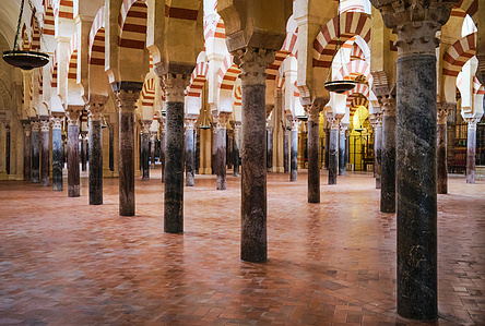 ​The expansion of  Abd al-Rahman III with Horseshoe arches in the Mosque of Córdoba, showcasing intricate Moorish architecture and detailed geometric patterns.