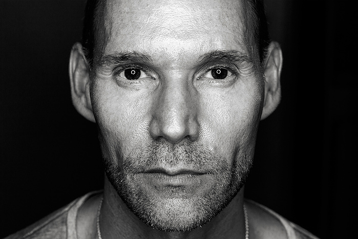Black + White Fine Art Portrait of a white Canadian man in his late 50’s, with a neutral expression, silhouetted with a black background
Fine Art Portrait
Black + White Photography
Fine Art Gallery
Nicola Kinloch photography
Florence Biennale