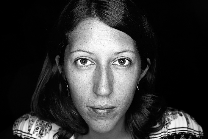 Black + White Fine Art Portrait of a french women in her 30’s, with a neutral expression, silhouetted with a black background.
Fine Art Portrait
Black + White Photography
Fine Art Gallery
Artistic Photography
Ring Light Photography
