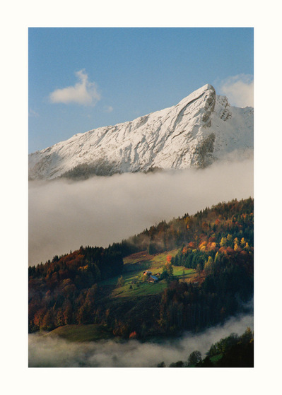 Fine Art print edition of 7 signed & numbered. 50x70 or 30x40 cm on Hahnemühle Bright White paper. Olivier Montay photographer. Patches of light on grassy slopes of the mountains, billows of mist linger in valleys. France, Haute-Savoie. Film photography 