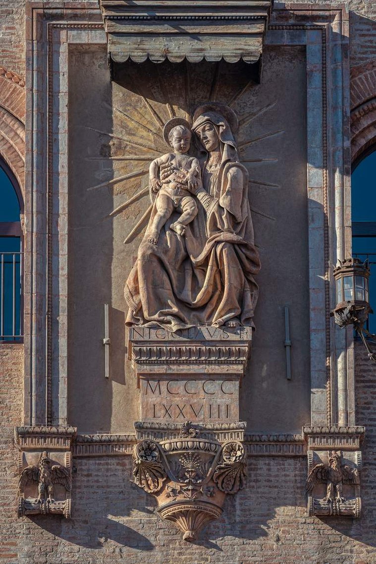 Madonna and Child dated 1478 on the facade of Palazzo d Accursio in Bologna Italy .    Niccolò dell'Arca 