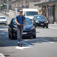 Quartiere Bolognina Monopattino nel traffico Bologna Italia  people, Bologna