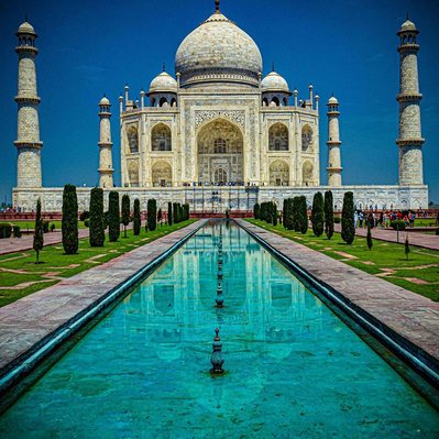 A high quality print available to buy of the Taj Mahal surrounded by bright turquoise waters, Agra, Uttar Pradesh, India.