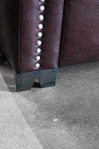 Hammer and Nails Grooming upholstered chair leg detail 