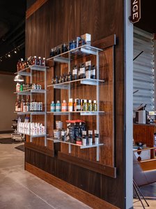 Retail and merchandising fixtures for barbering franchise.