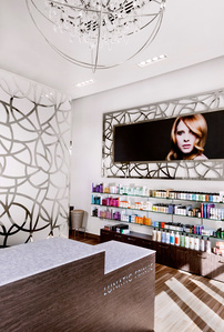 Salon reception area with desk and retail display