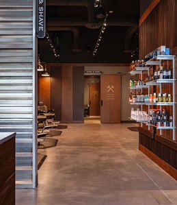 Retail display fixtures and architectural millwork for barbering franchise.