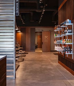 Retail display fixtures and architectural millwork for barbering franchise.