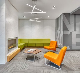 Custom fireplace, wall panels, seating and graphics for reception area.