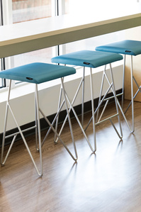 Counter and upholstered stools for Code Ninjas