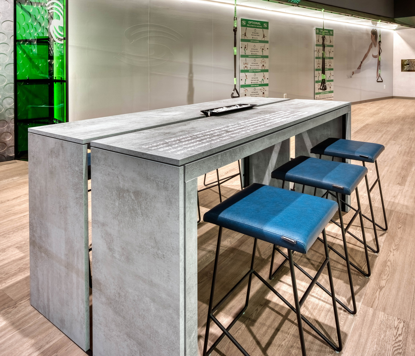 Consultation desk and seating for Stretch Authority health and wellness franchise.