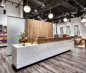 Minimalist check in desk and wall system for  Lunatic Fringe Salon franchise