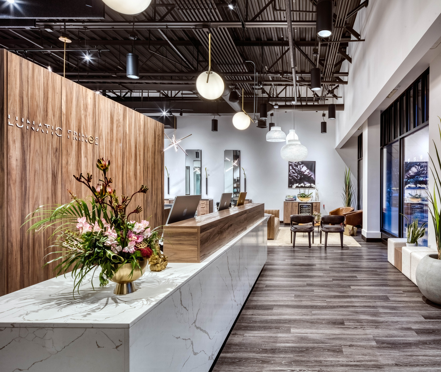 Modern lobby and check in desk for Lunatic Fringe Salon franchise