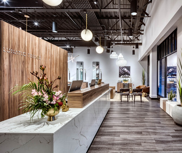 Modern lobby and check in desk for Lunatic Fringe Salon franchise