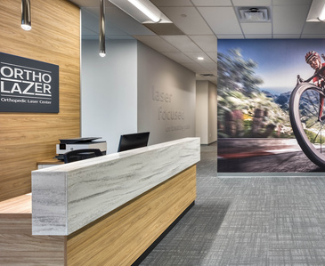 Reception area interior and furnishing design for Ortholazer franchise.